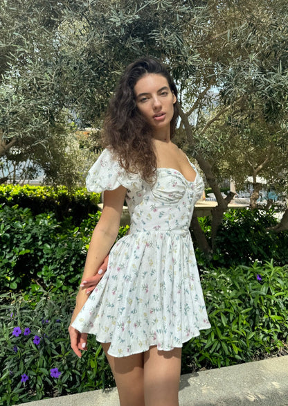 Girl in short white floral dress