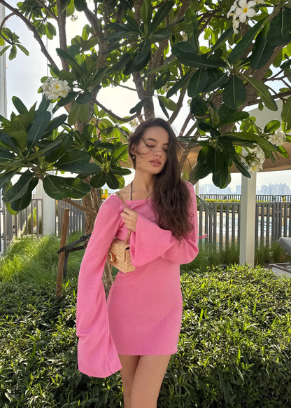 Girl in pink knitted dress