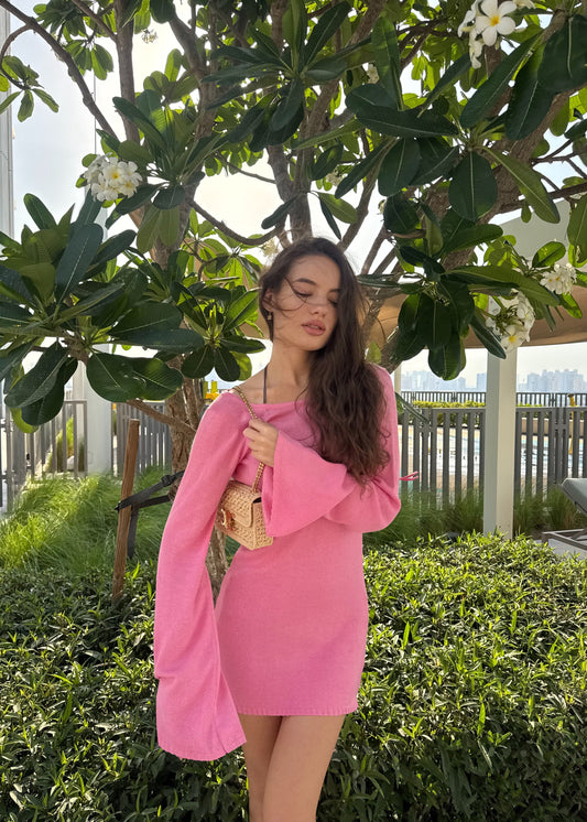 Girl in pink knitted dress