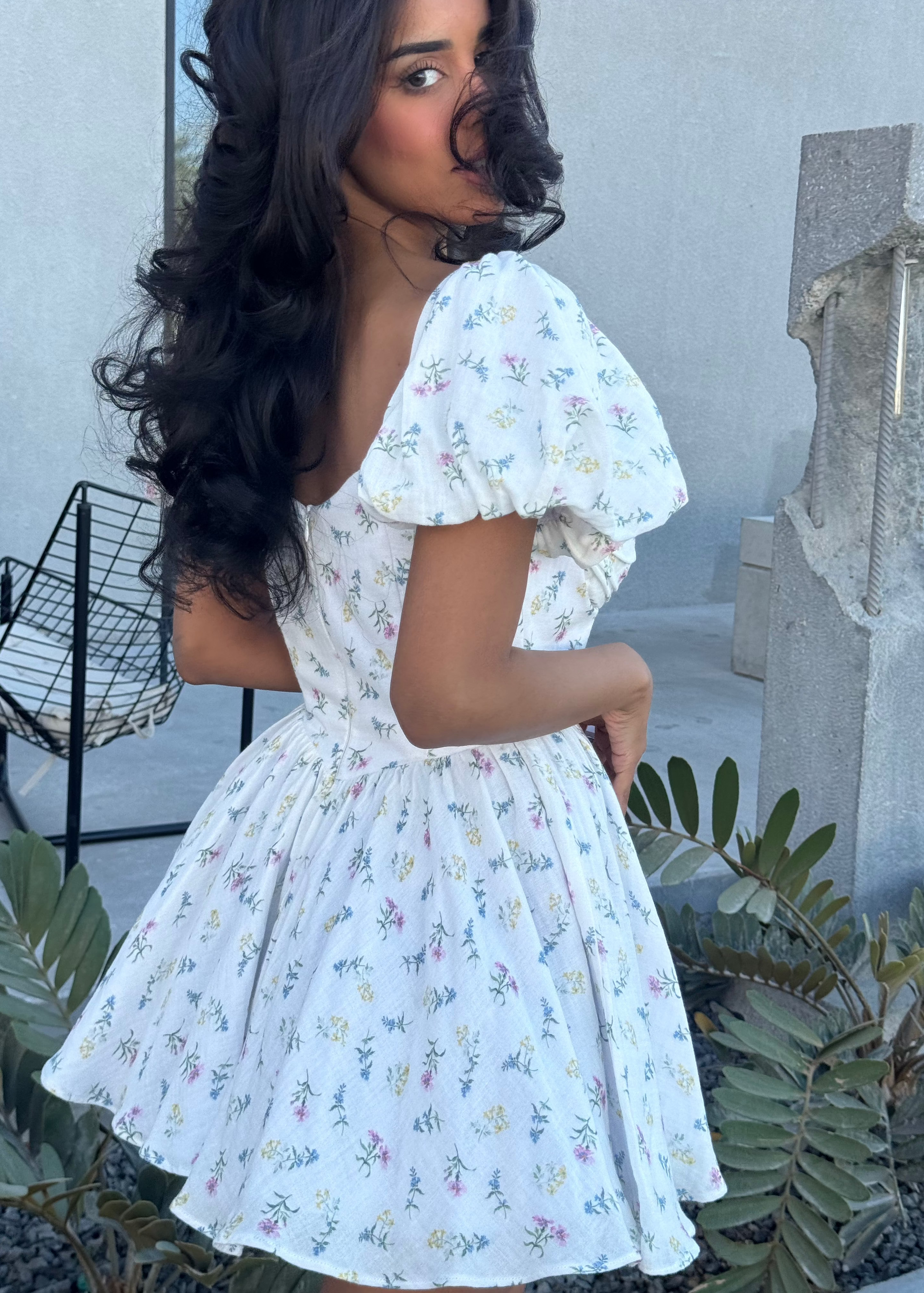 Girl in short white floral dress