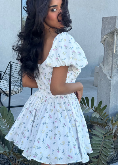 Girl in short white floral dress