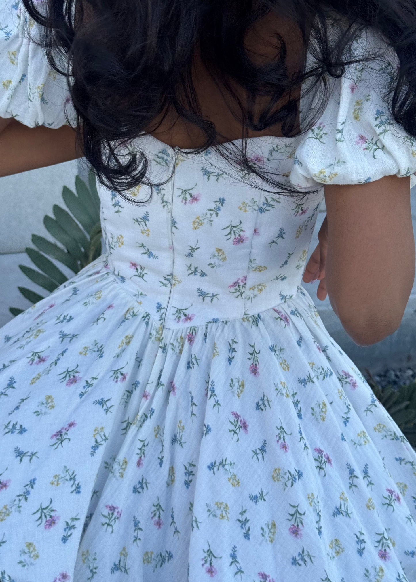 Girl in short white floral dress