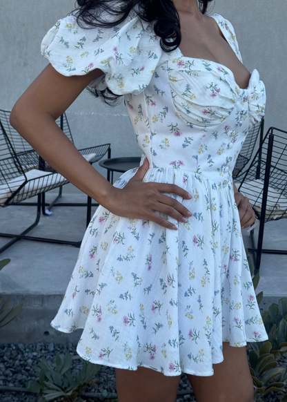 Girl in short white floral dress