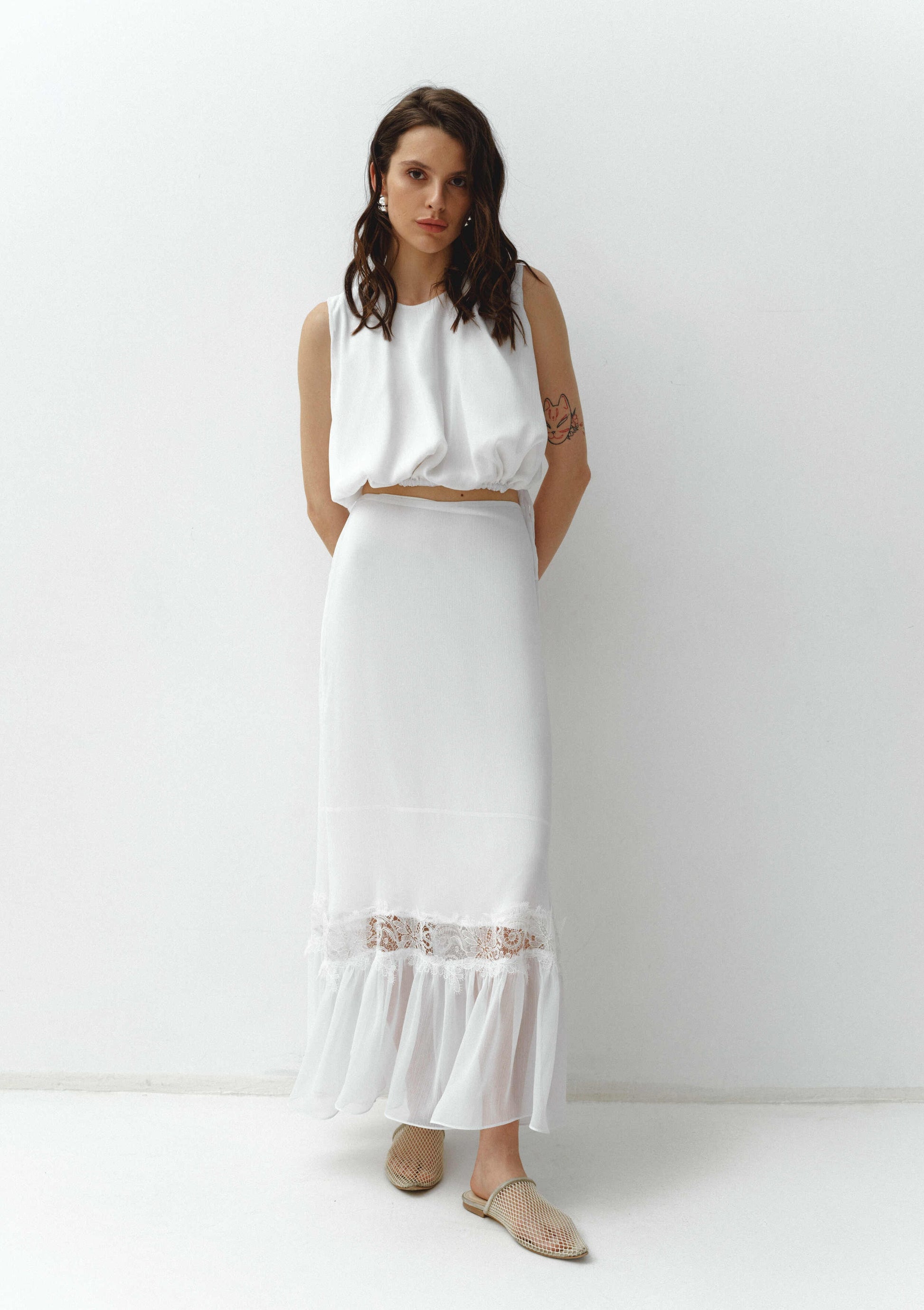 Girl in white chiffon suit with long skirt