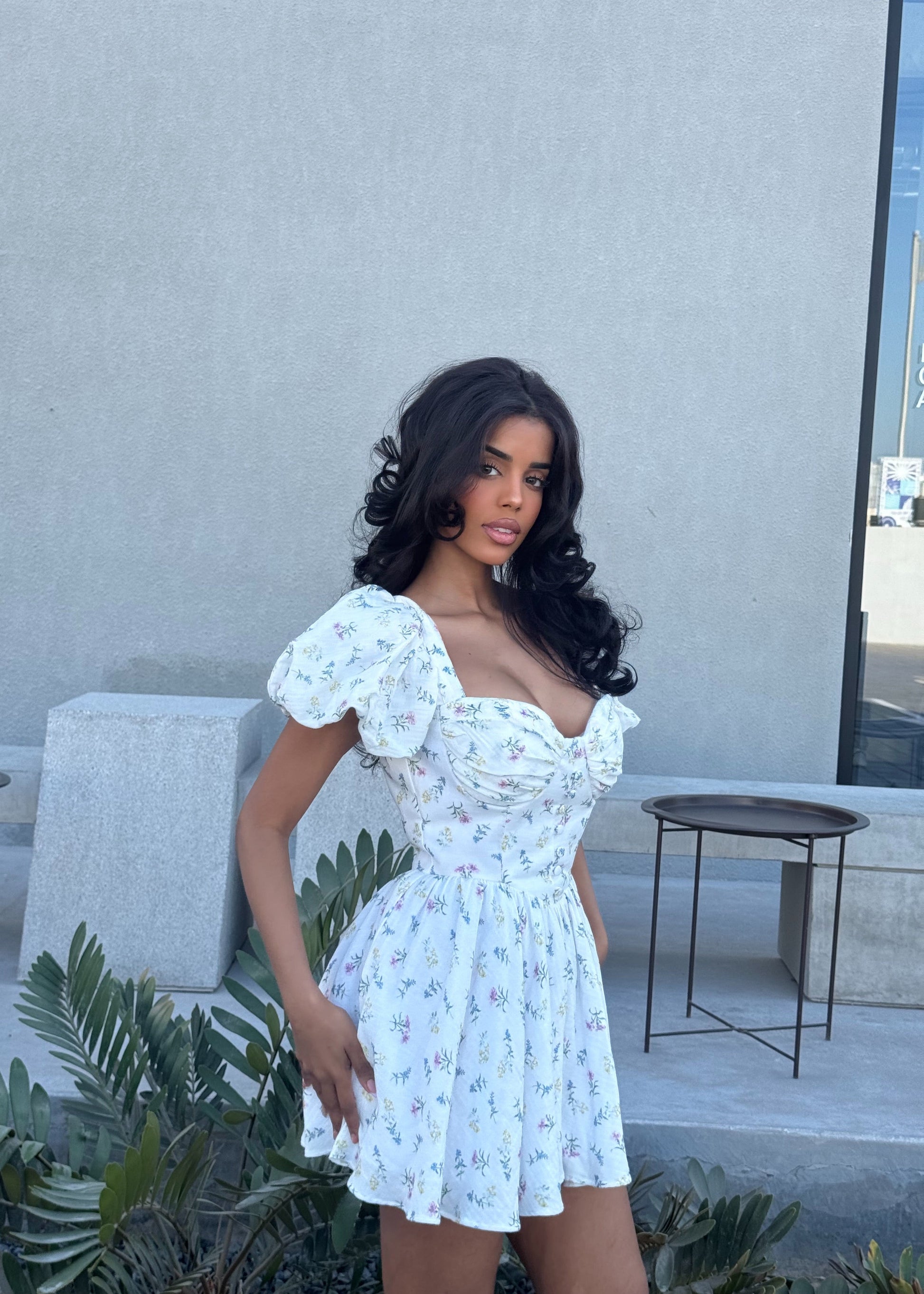 Girl in short white floral dress