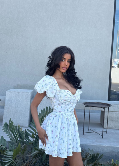 Girl in short white floral dress