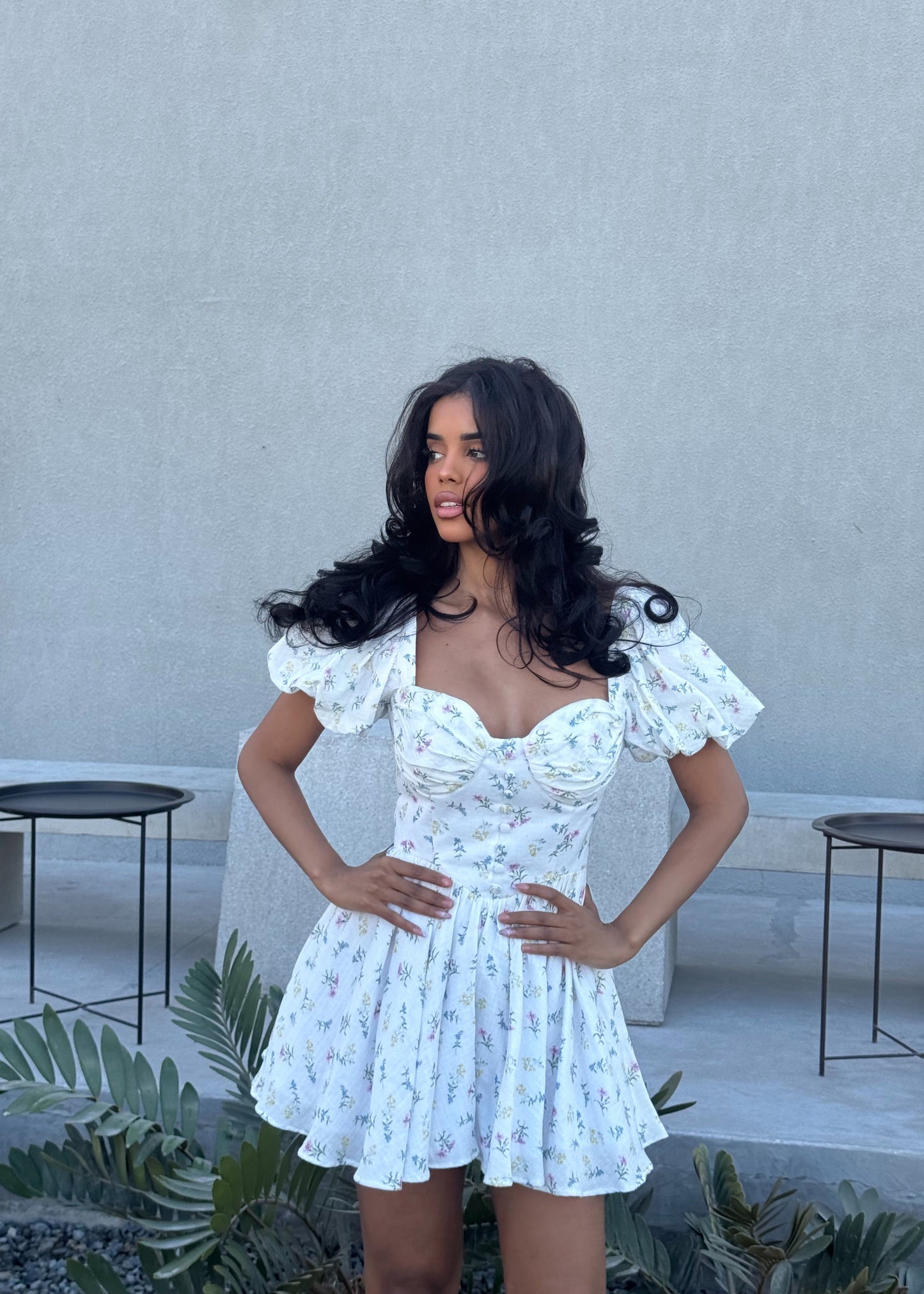 Girl in short white floral dress
