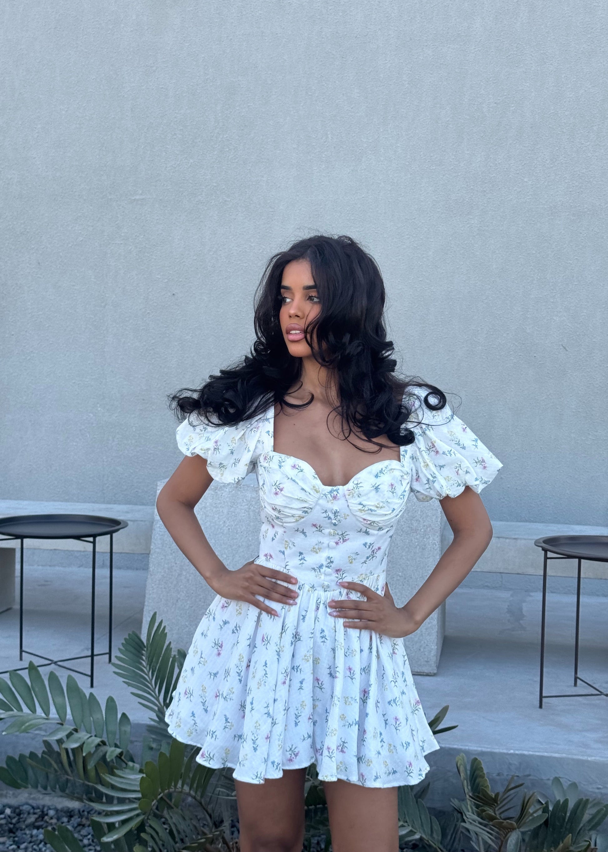 Girl in short white floral dress
