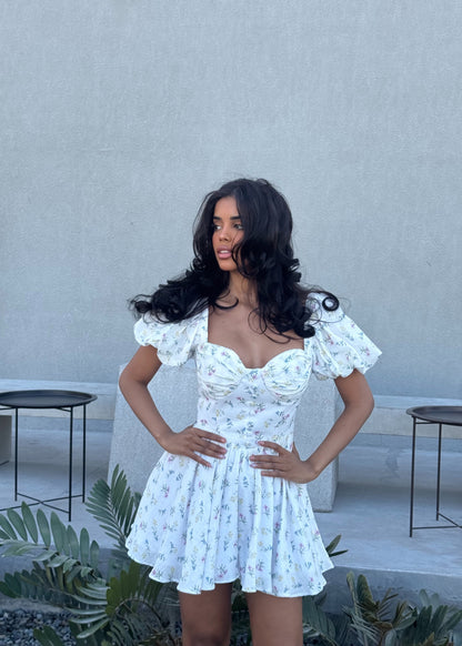 Girl in short white floral dress
