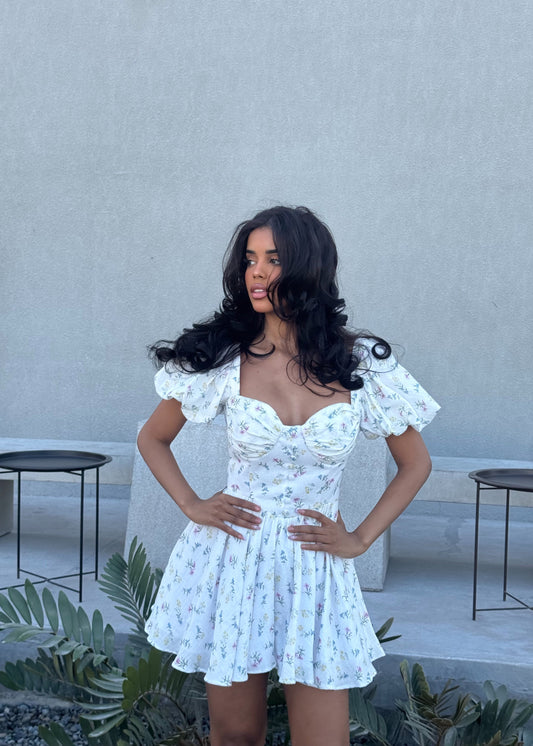 Girl in short white floral dress