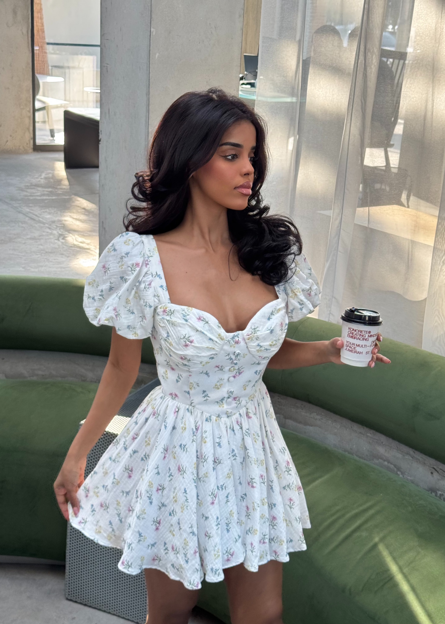 Girl in short white floral dress