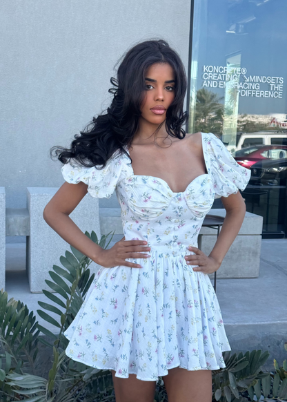 Girl in short white floral dress