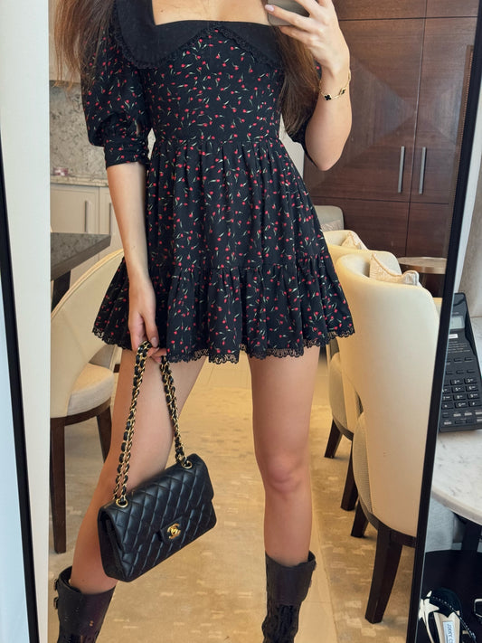 Girl in black floral dress