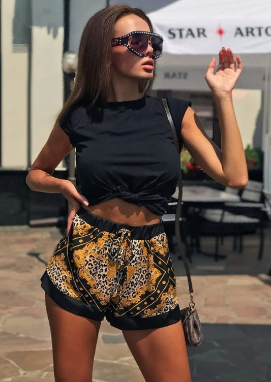 Girl in shorts Versace print