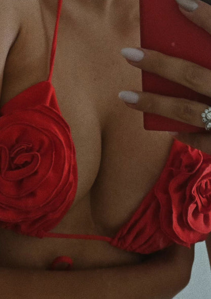 Girl in red swimsuit with roses