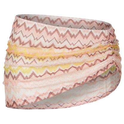 Multicolored zigzag patterned headband on a white background