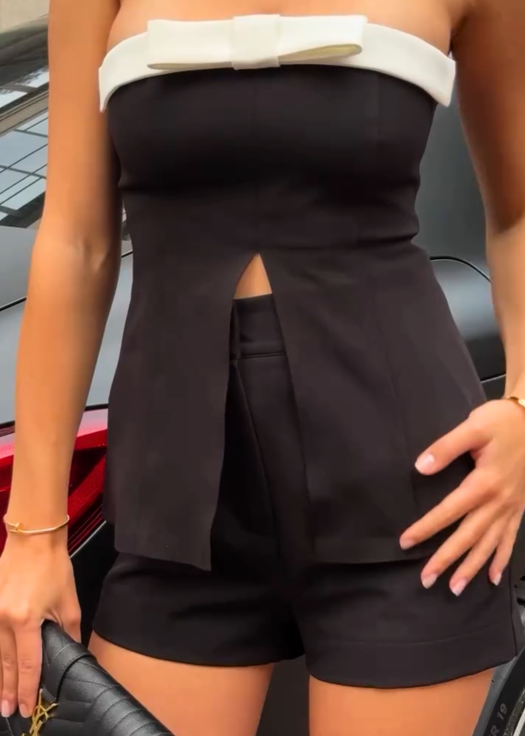 Girl in black suit top with shorts