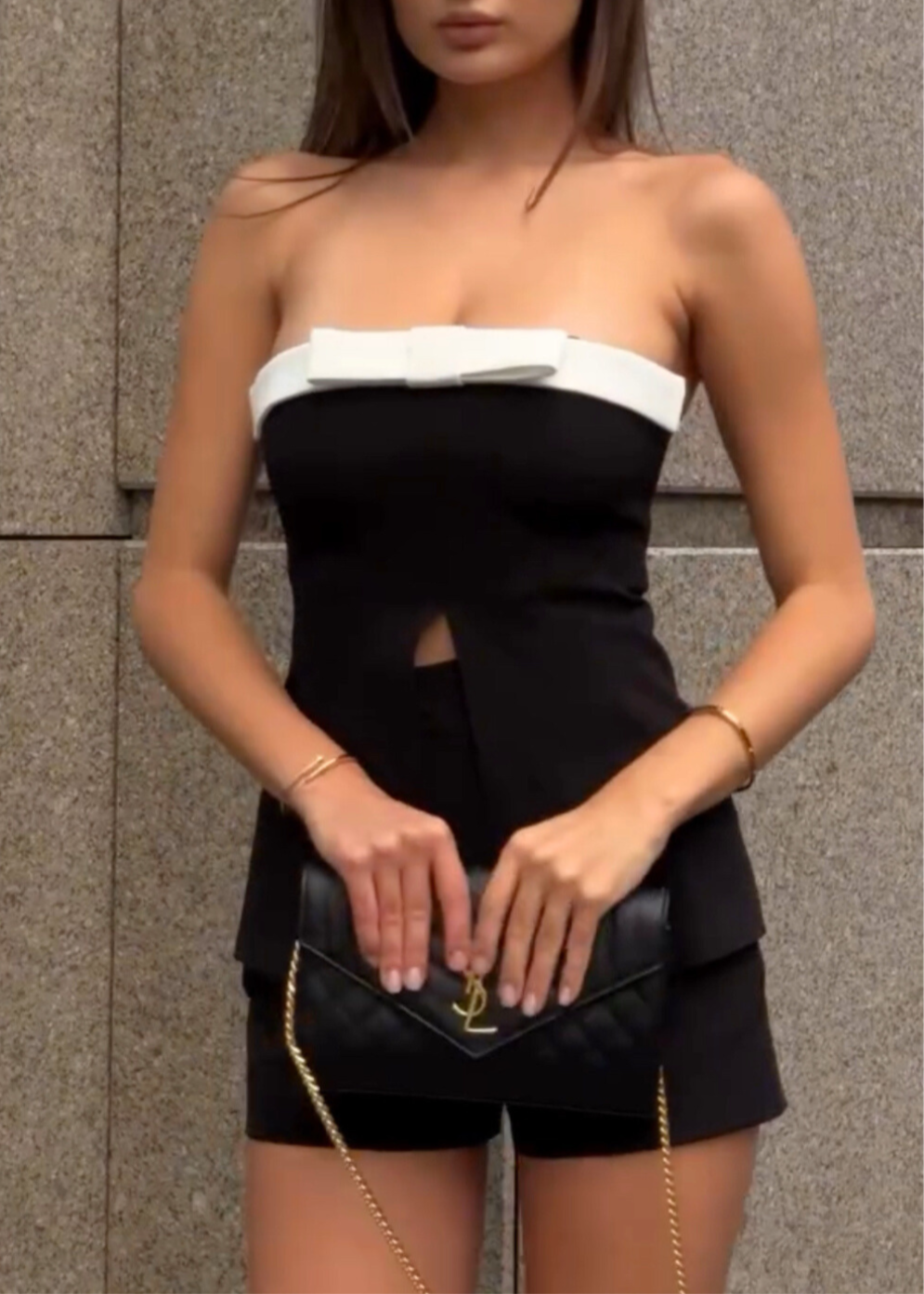 Girl in black suit top with shorts