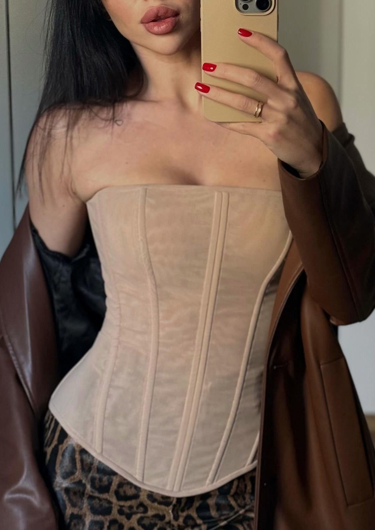 Girl in nude or beige corset