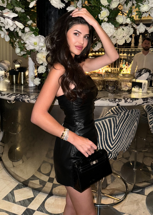 Girl in black leather dress