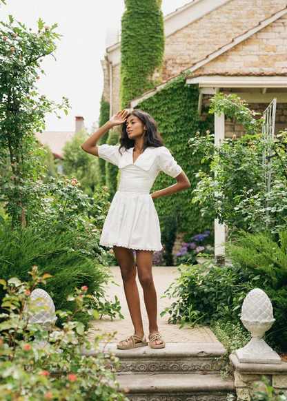 Girl in white dress with collar