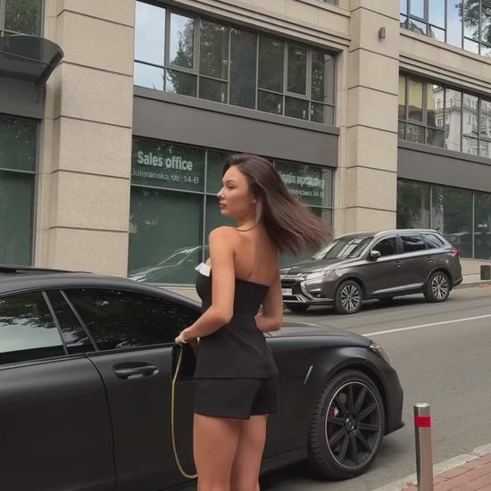 Girl in black suit top with shorts